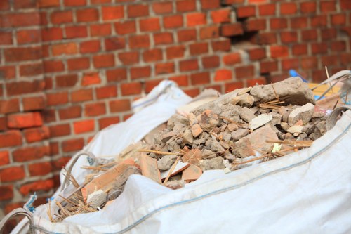 Professionals clearing a cluttered loft space